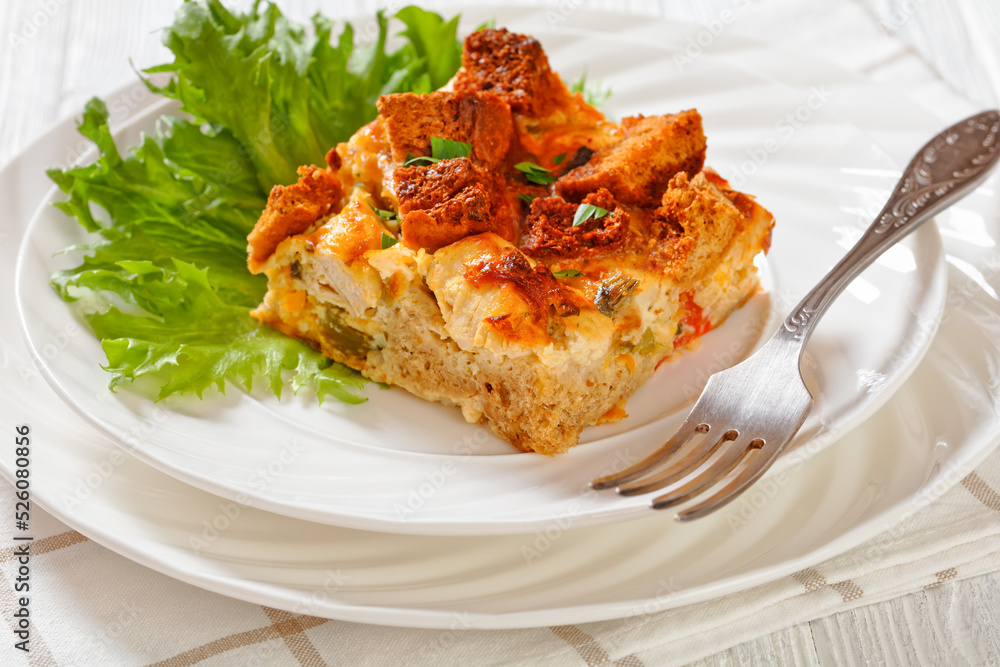 Scalloped Chicken Casserole topped with croutons