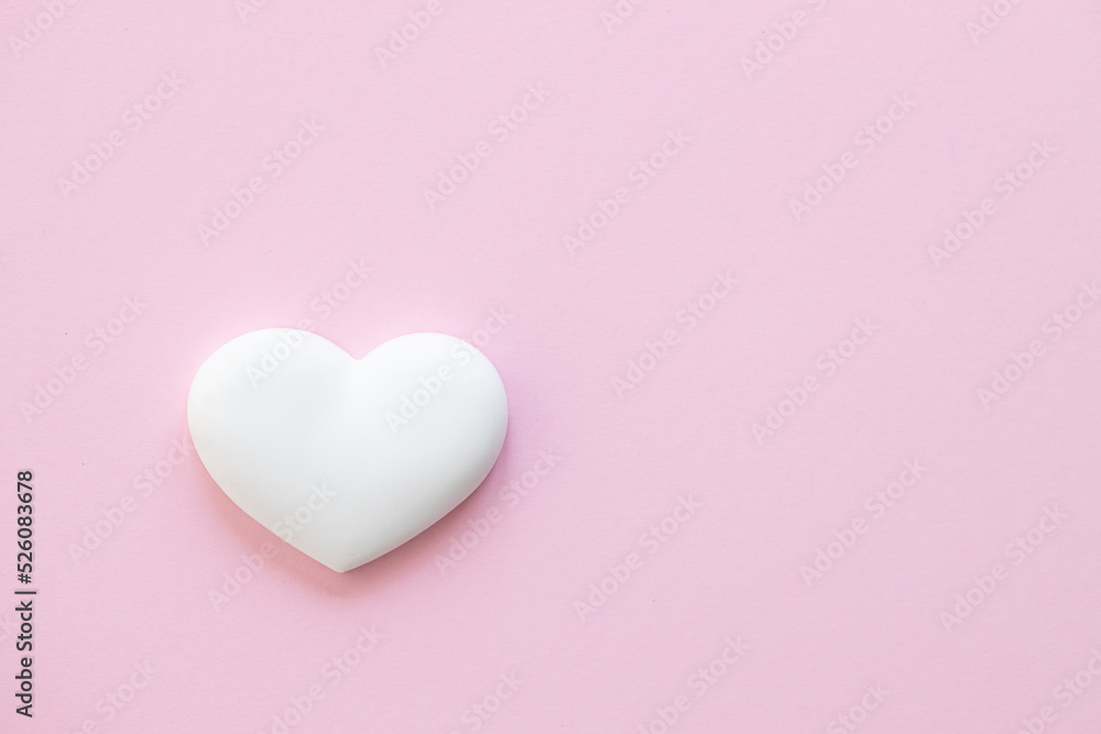 White heart on pink background