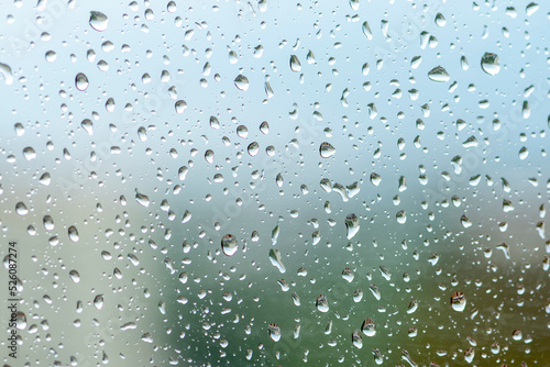 large raindrops on the window glass, rainy weather