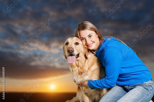 Young woman hugging dog happy on the beach at travel and vacation. Female Happy smile with pet as new life © BillionPhotos.com