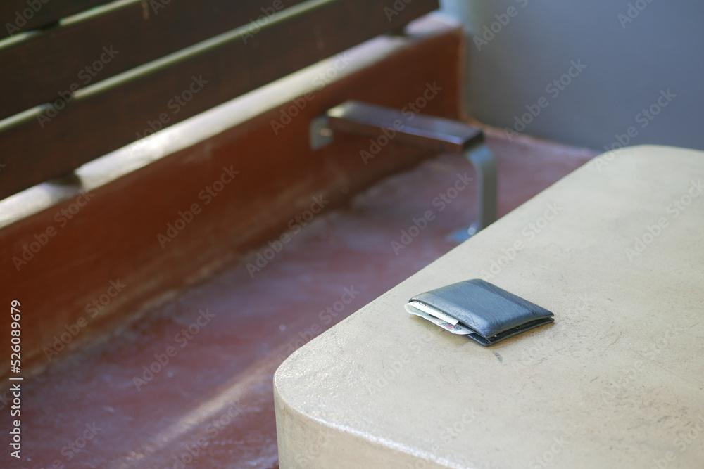 left wallet on a bench in the park left wallet on a bench in the park