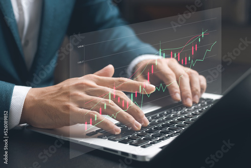 Businessman touching virtual screen Analysis of global business growth and asset investment charts, strategic planning to increase asset profits, long-term investment plans.