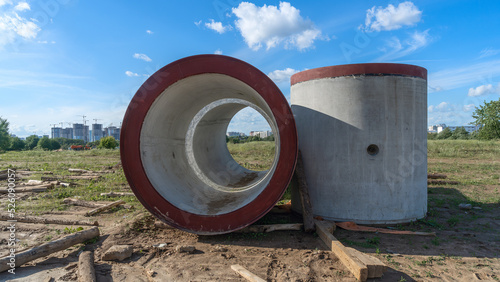 Wallpaper Mural Reinforced concrete storm sewer pipes of large diameter stacked at a construction site. Sewer Large diameter pipes. Torontodigital.ca