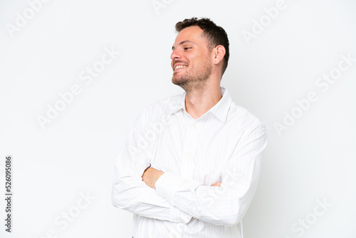 Young caucasian handsome man isolated on white background happy and smiling © luismolinero
