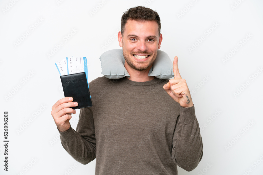 Young caucasian man holding a passport isolated on white background showing and lifting a finger in sign of the best Young caucasian man holding a passport isolated on white background showing and lifting a finger in sign of the best