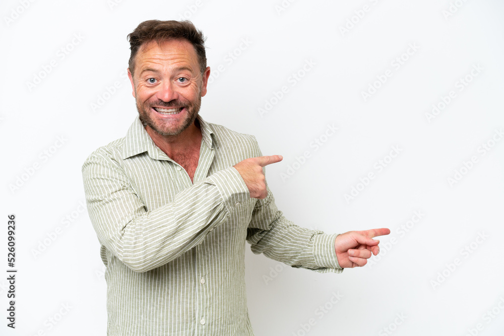 Middle age caucasian man isolated on white background surprised and pointing side Middle age caucasian man isolated on white background surprised and pointing side