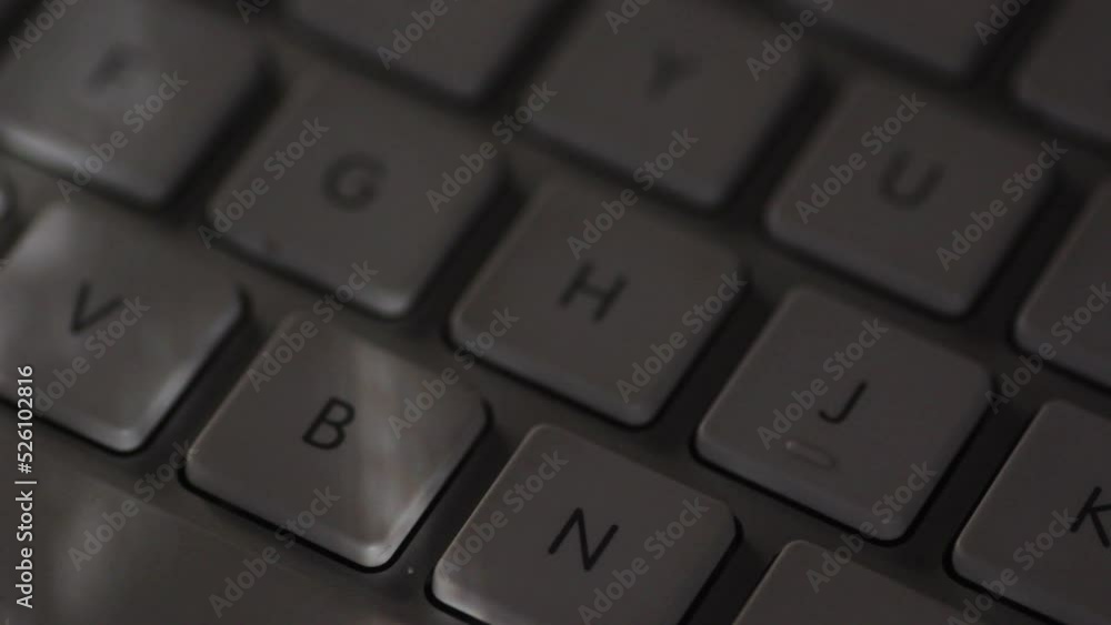Closeup of computer keyboard with light shining from window Closeup of computer keyboard with light shining from window