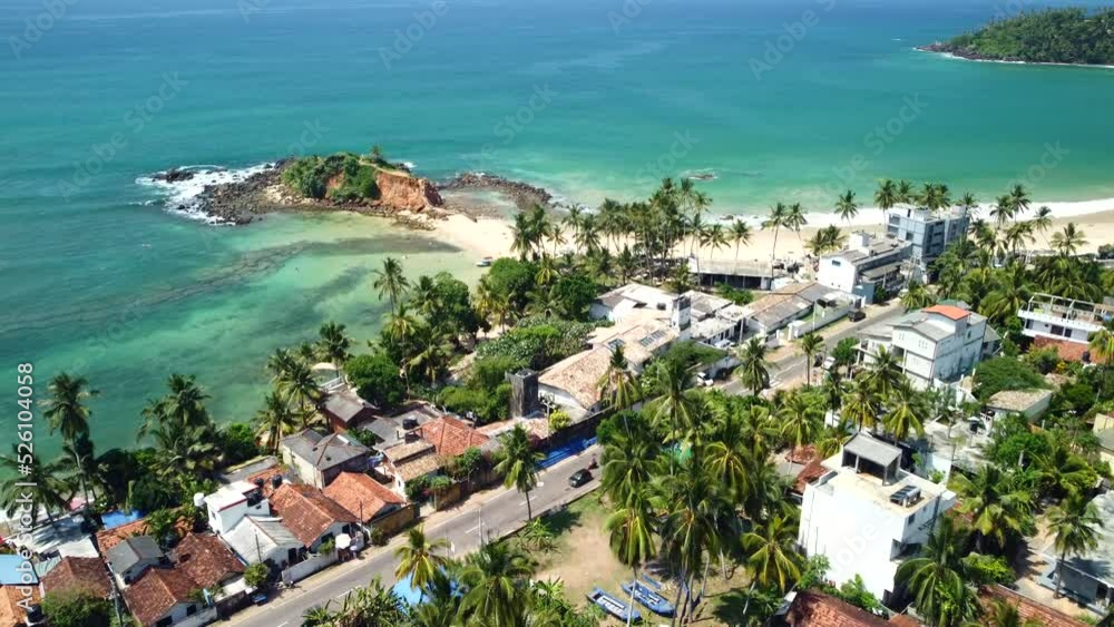 Aerial view of coastline of Mirissa, Sri Lanka. Breathtaking tropical landscape, 4k footage. Wavy aqua blue Indian ocean, palm trees and sandy beaches Aerial view of coastline of Mirissa, Sri Lanka. Breathtaking tropical landscape, 4k footage. Wavy aqua blue Indian ocean, palm trees and sandy beaches