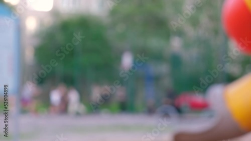 abstract background in blur, playground with children running and playing, play area without focus, sunny summer day