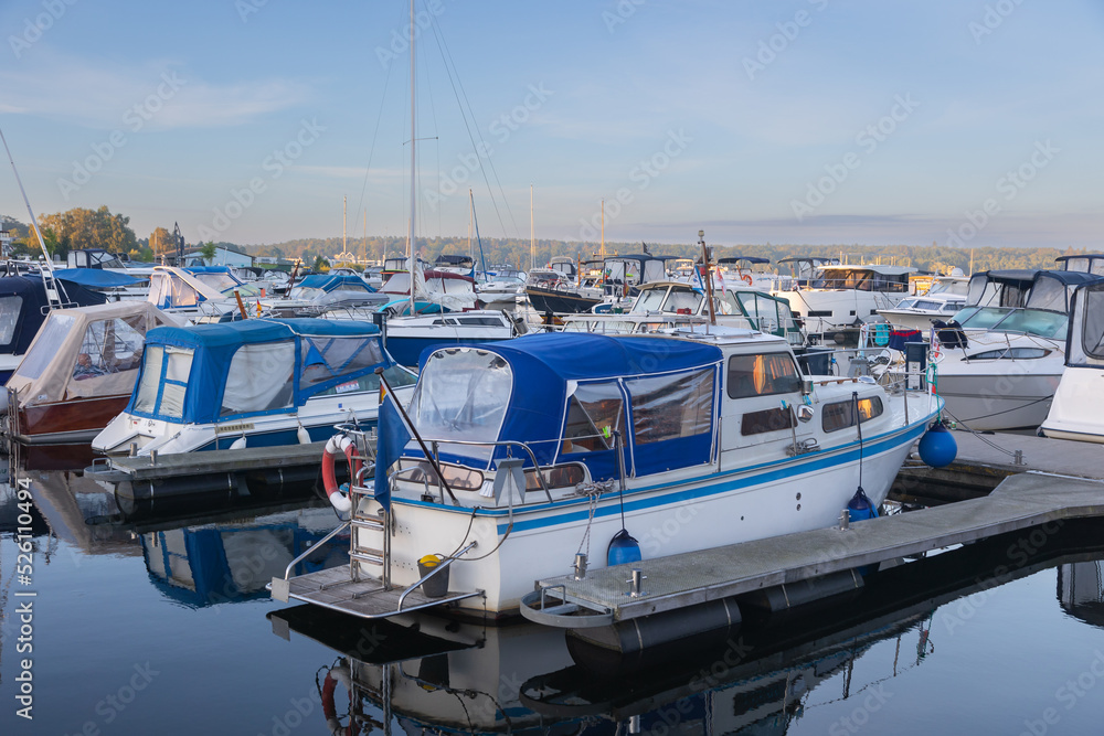 Fototapeta premium boats and yachts at landing stages in a marina