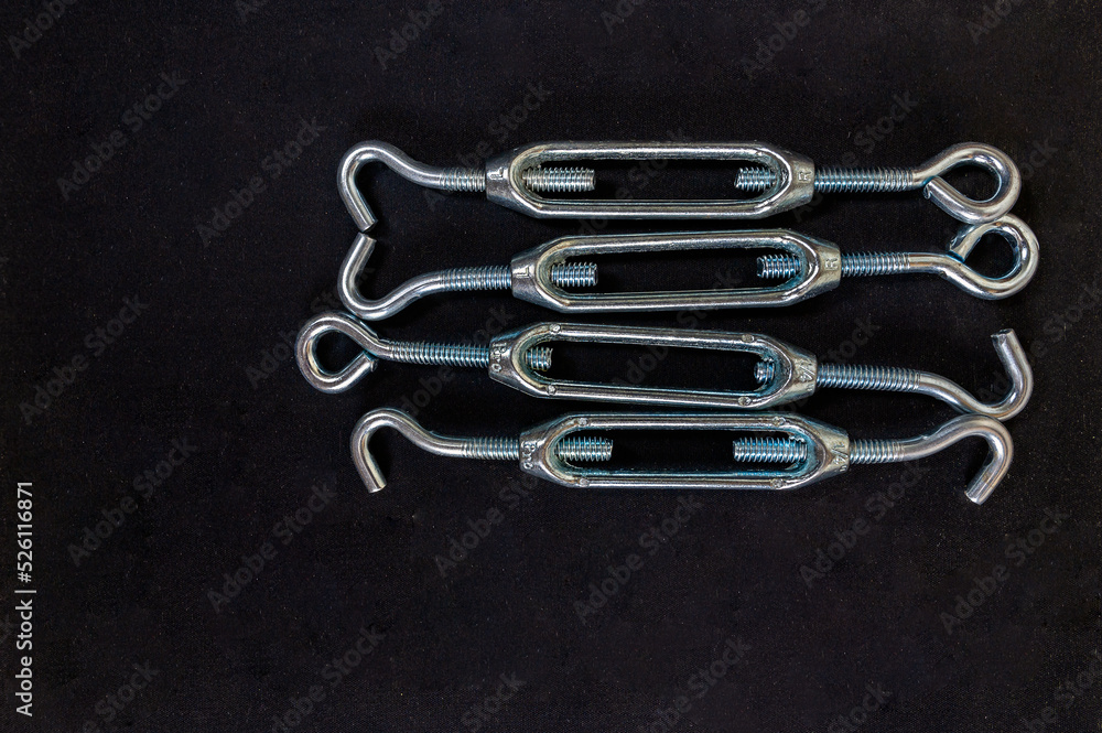 Capture (lanyard) - a device for tightening and choosing slack rigging cables on a black background, Top view, Copy space. Capture (lanyard) - a device for tightening and choosing slack rigging cables on a black background, Top view, Copy space.