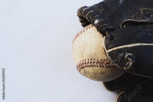 Photography Sports season background with baseball glove and ball on white background closeup