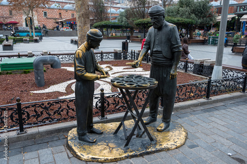 Photography Turkey, Istanbul - January 2022: Old Market, monument to the seller of bagels
