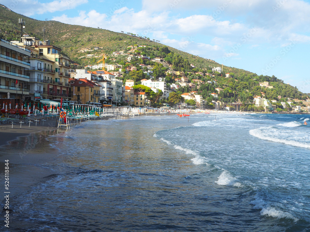 Beautiful view on a sunny day of the sea and the town of Alassio with colorful buildings, Liguria, Italian Riviera, region San Remo, Cote d'Azur, Italy