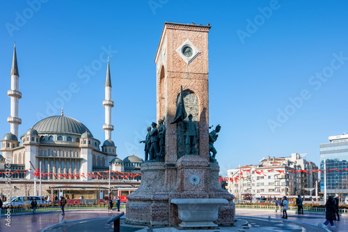 ISTANBUL, TURKEY - January 2022: Taksim Square with Taksim Mousque at the background photo