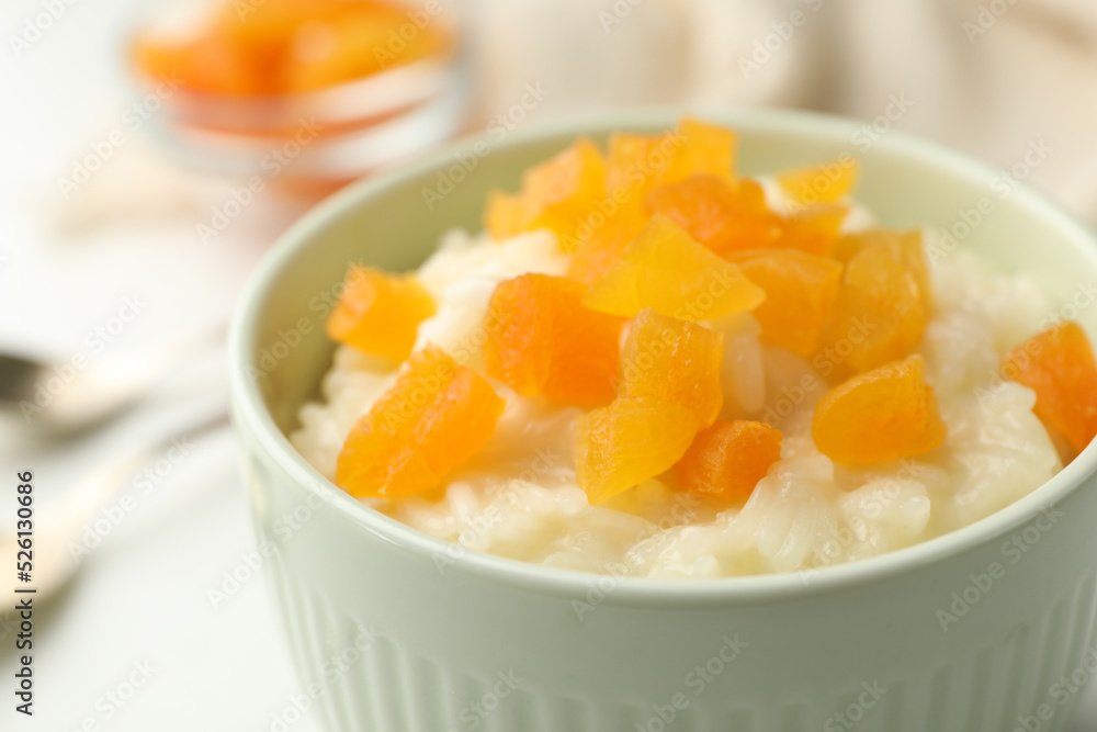 Delicious rice pudding with dried apricots, closeup Delicious rice pudding with dried apricots, closeup