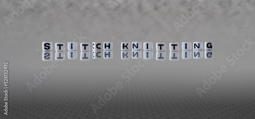 stitch knitting word or concept represented by black and white letter cubes on a grey horizon background stretching to infinity