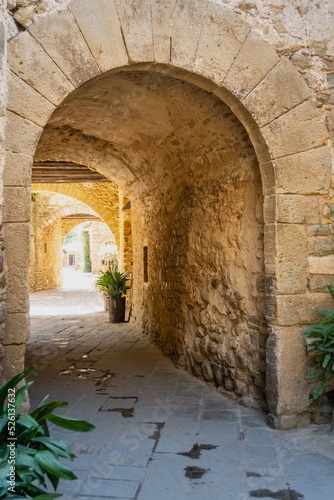 Monells  a beautiful medieval village in the Baix Empord  . Gerona. Spain. Arch in the narrow streets of the village