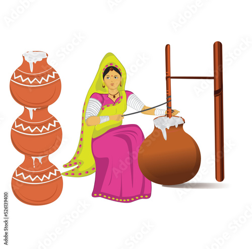 Indian Village woman making butter with bilona
