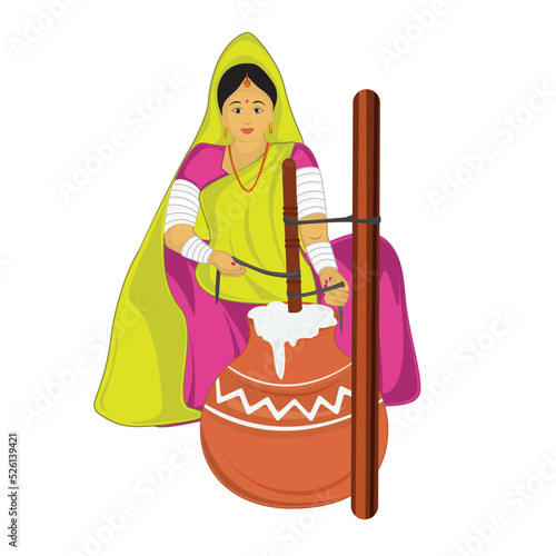 Indian Village woman making ghee on bilona