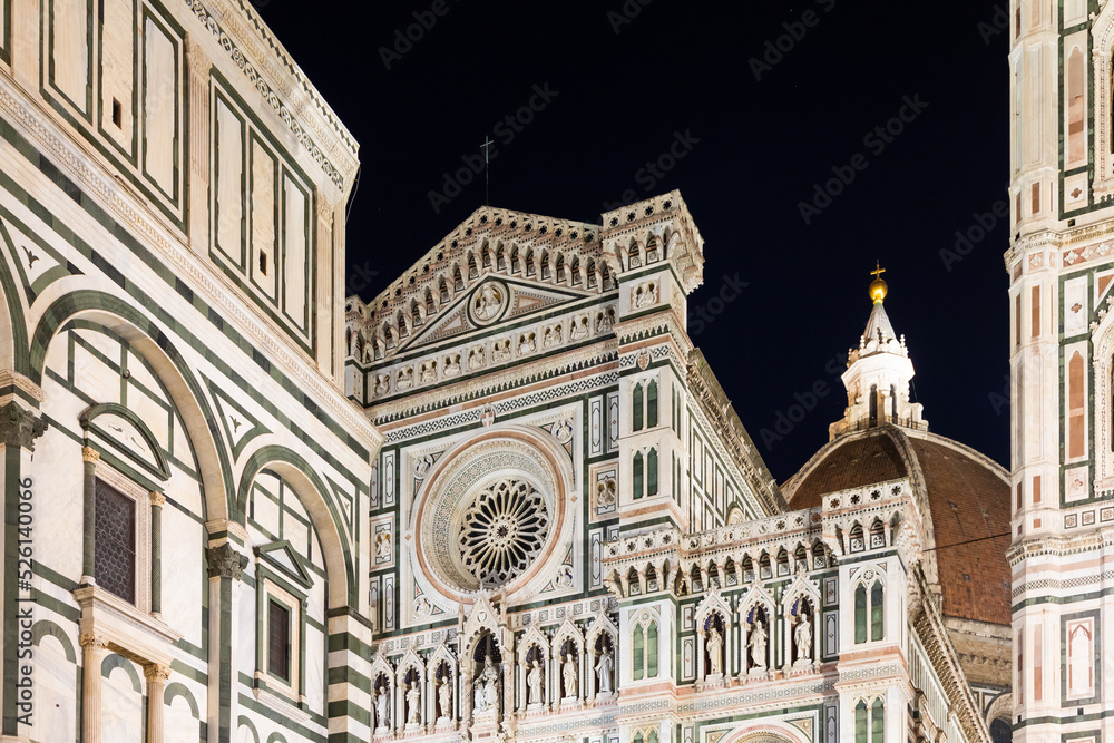 Italy, Florence by night. The  illuminated architecture of the cathedral exterior.