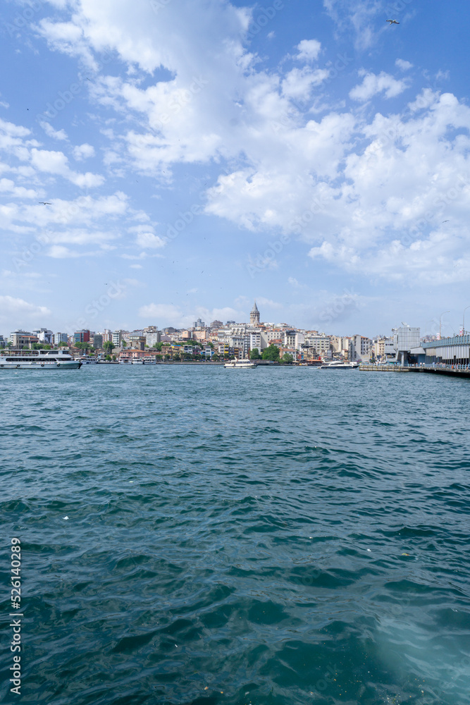View of the Galata neighborhood, with the Galata tower in the middle of the buildings, photograph taken from the other shore of the Bosphorus