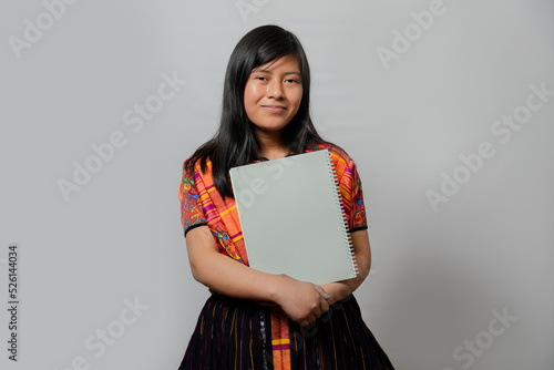 Hispanic young woman with notebook - Mayan teenager ready to go to study - Latina student on white background