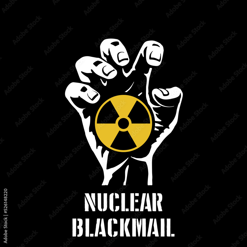 Nuclear blackmail. Yellow radiation sign in the dead hand with a