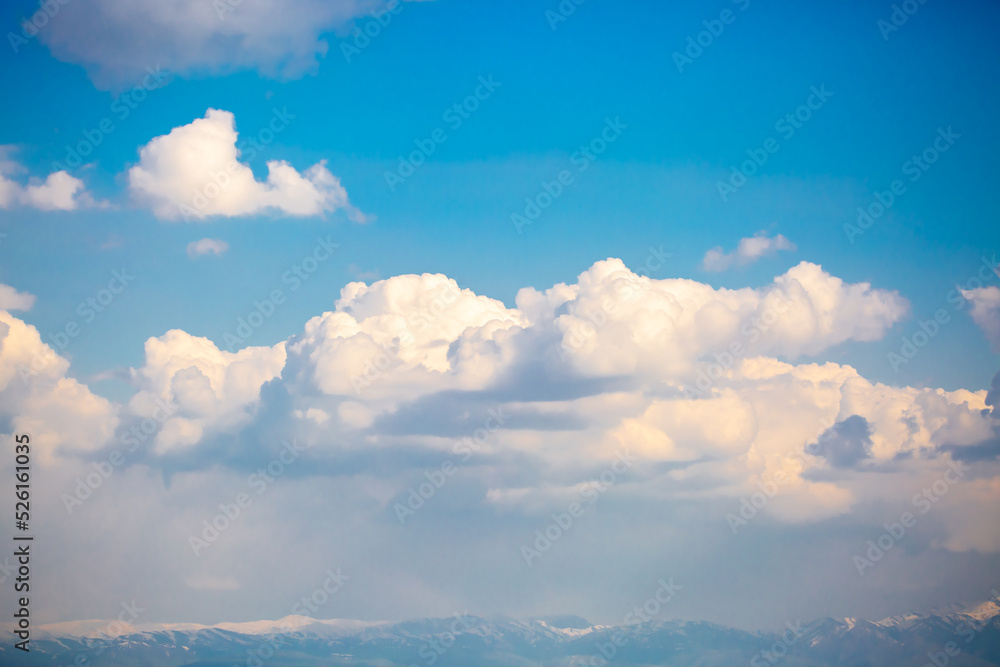 Beautiful clouds against the blue sky. Fluffy clouds, cloudy weather.