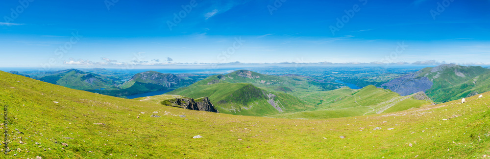 A scenic panoramic view from Mount Snowdon on a bright sunny day, Wales A scenic panoramic view from Mount Snowdon on a bright sunny day, Wales