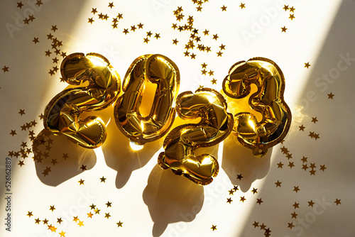 Photography 2023 number made from foil golden balloons. New year concept.