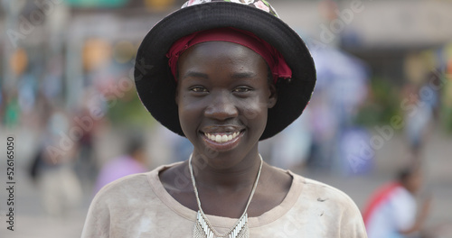 Youn black woman smile happy face portrait on a city street photo