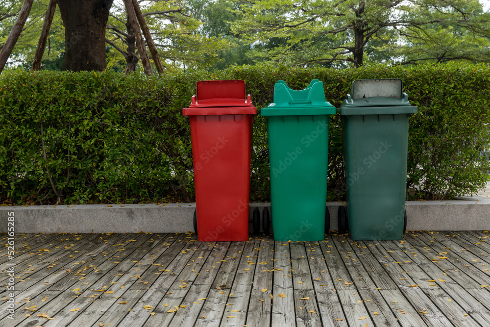 Garbage bin in public park. colorful trash bin. wheelie bin for rubbish, Public trash background Garbage bin in public park. colorful trash bin. wheelie bin for rubbish, Public trash background