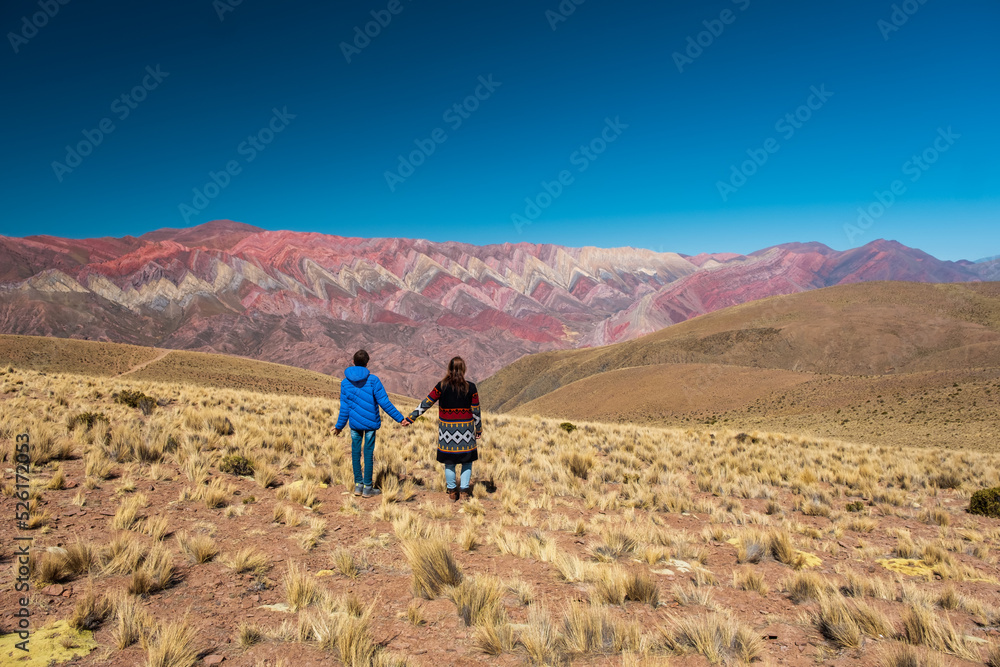Mother and son holding hands looking at the wonderful landscape in Hornocal, Jujuy Argentina Mother and son holding hands looking at the wonderful landscape in Hornocal, Jujuy Argentina
