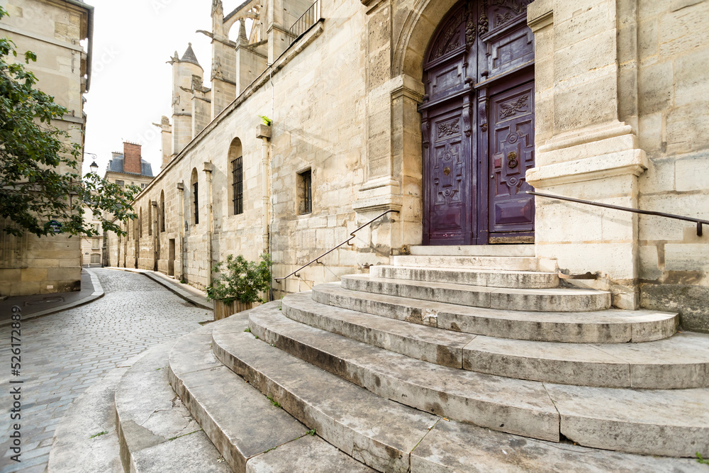 Obraz premium Street in old town, Paris France entrance of old church