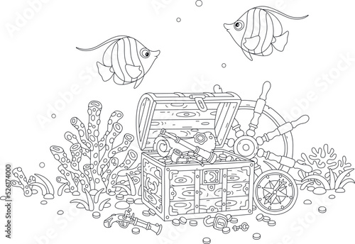 Funny tropical butterfly fishes swimming over a treasure chest full of gold coins, a pirate map and an old wooden helm with a marine compass from a sunken filibuster sailboat on a coral reef