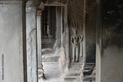 Angkor Wat Corridor with Female Relief Sculpture by Door, Siem Reap, Cambodia © Globepouncing