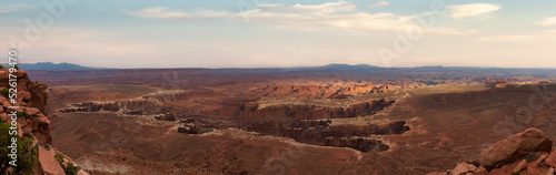 Scenic Panoramic View of American Landscape and Red Rock Mountains in Desert Canyon. Colorful Sunset Sky Art Render. Canyonlands National Park. Utah  United States. Nature Background Panorama