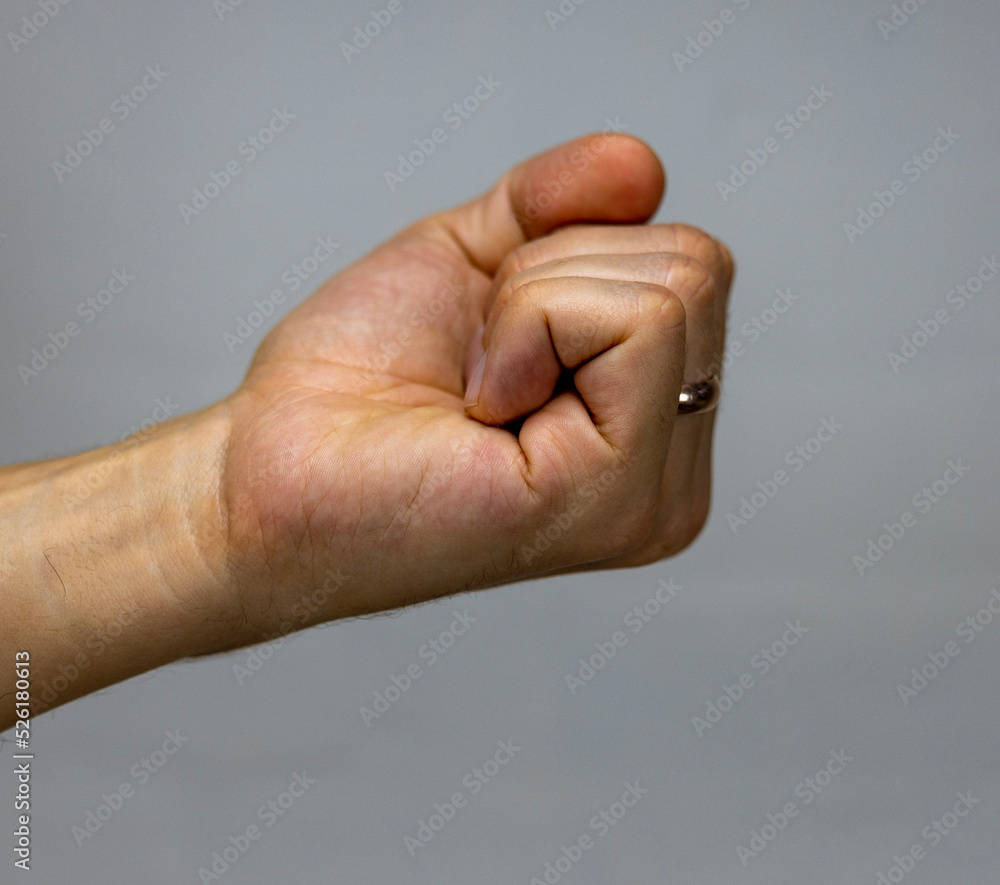 A fist punching, defending or attacking. A fist punching, defending or attacking.