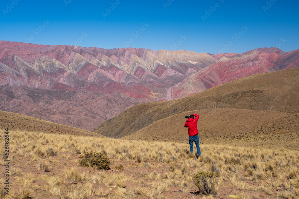 Man photographing the beautiful landscape in Hornocal, Jujuy Argentina