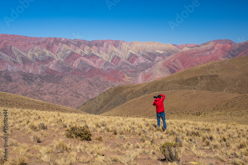 Man photographing the beautiful landscape in Hornocal, Jujuy Argentina