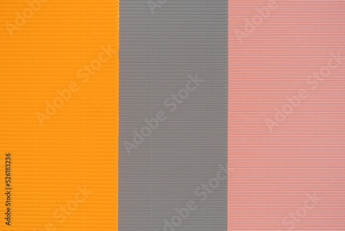 Gray, pink and orange three tone color paper background with stripes. Abstract background modern hipster futuristic. Texture design