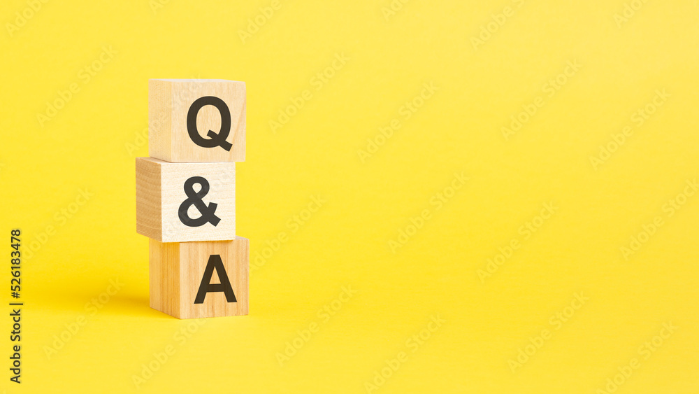 Q A - Question and Answer - text on wooden block with yellow background. Q A - Question and Answer - text on wooden block with yellow background.