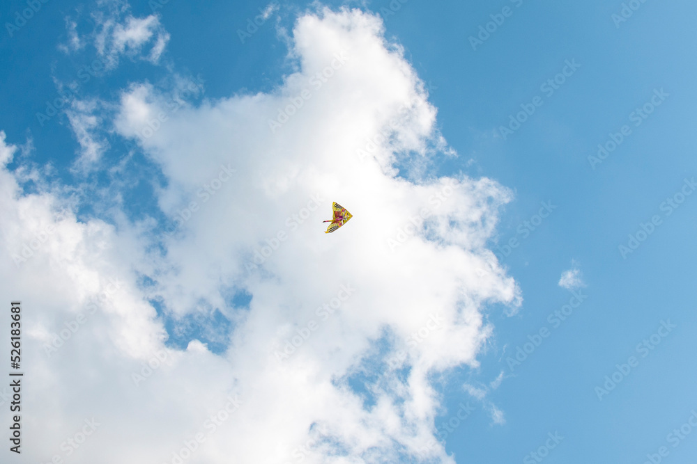 wind kite flying in the blue sky wind kite flying in the blue sky