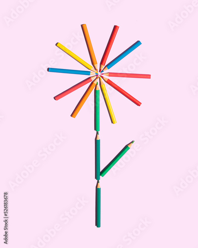 Minimal composition with colored pencils on pastel bright purple background. Back to school idea. Creative education concept.