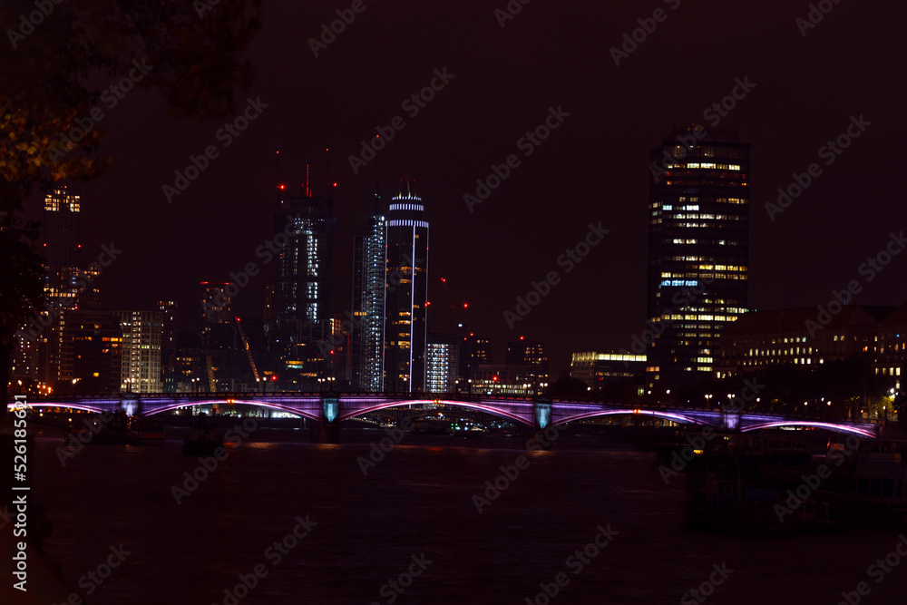 Colorful cityscape of London at night. Urban landscape illuminated. Colorful cityscape of London at night. Urban landscape illuminated.