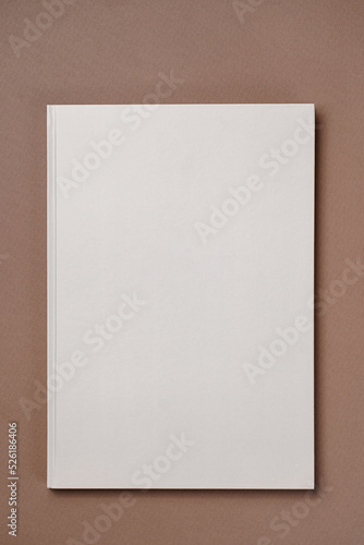 Gray Leather notebook on paper brown background, notepad mock up, top view shot