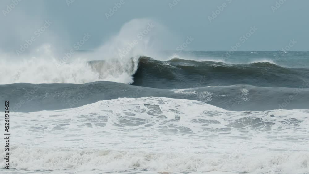 Big wave with foam and dirt breaks on the shore during strong storm in the Atlantic Ocean Big wave with foam and dirt breaks on the shore during strong storm in the Atlantic Ocean