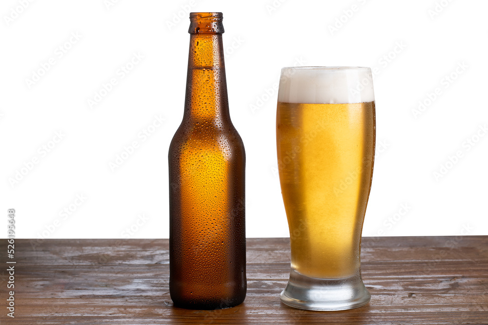 unlabeled beer bottle and glass with beer on white background