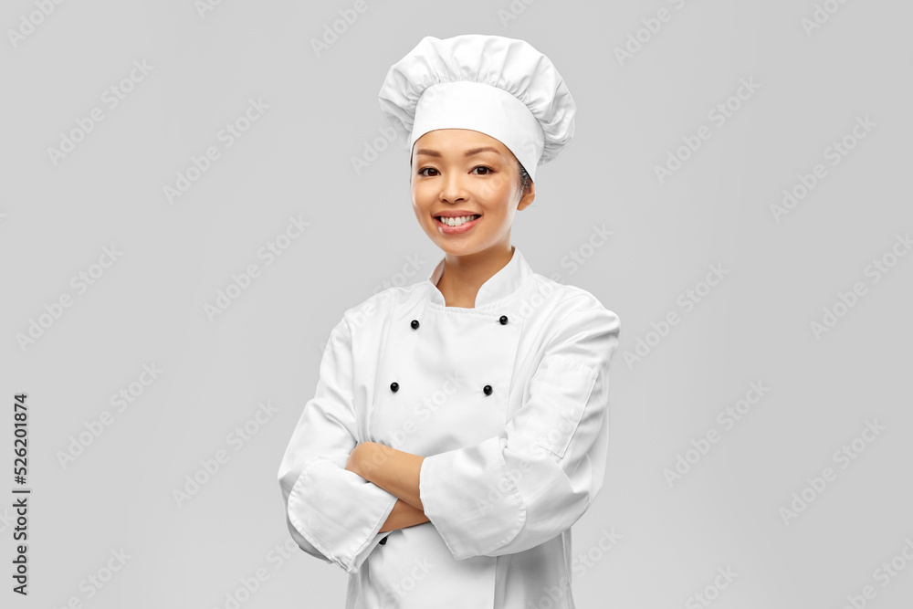 cooking, culinary and people concept - happy smiling female chef in white jacket over grey background cooking, culinary and people concept - happy smiling female chef in white jacket over grey background